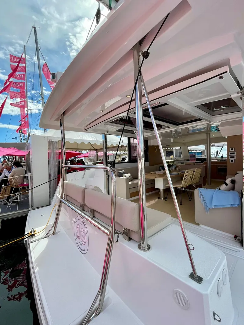 Slide: The Image of 2026 Bali CATSPACE catamaran with spacious deck and modern interior at a boat show. - 41