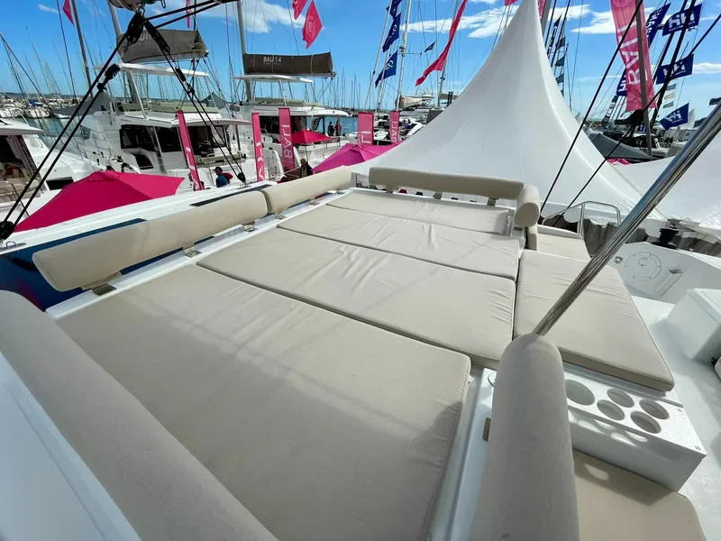 Slide: The Image of Luxurious 2026 Bali CATSPACE catamaran with spacious sunbathing deck at a marina. - 46