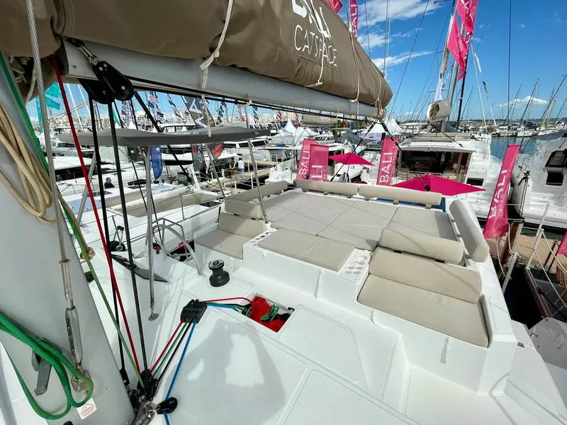 Slide: The Image of 2026 Bali CATSPACE catamaran at a boat show, featuring spacious deck and seating area. - 47