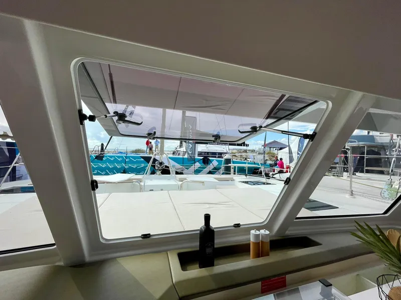 Slide: The Image of View from inside a 2026 Bali CATSPACE yacht, showcasing deck and marina scene. - 5