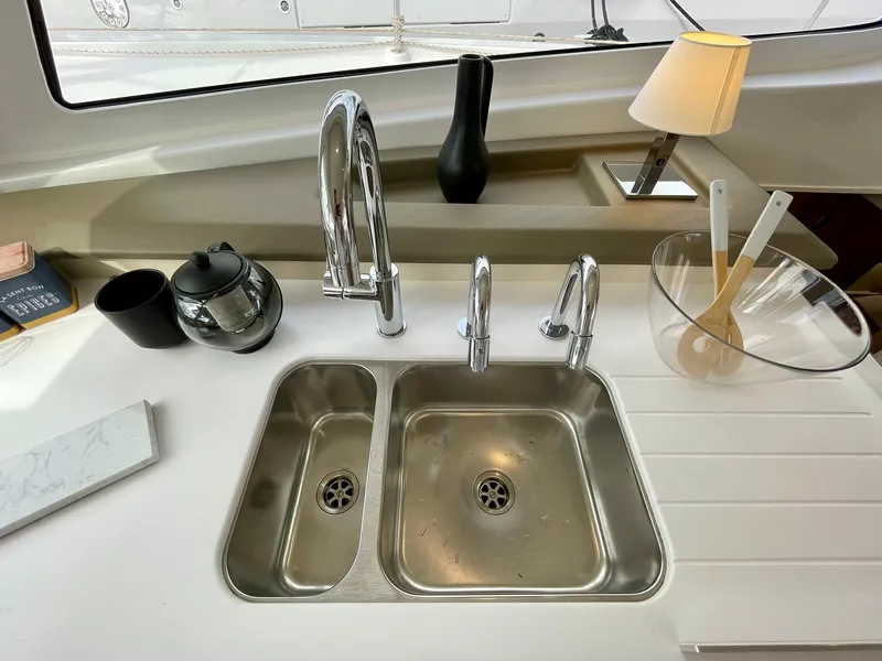 Slide: The Image of Modern kitchen sink area on 2026 Bali CATSPACE yacht with dual faucets and accessories. - 6