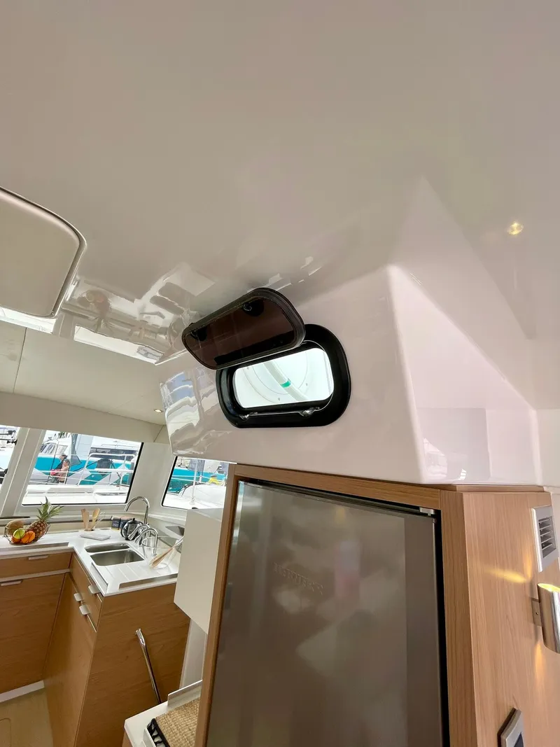 Slide: The Image of Interior of 2026 Bali CATSPACE yacht with modern kitchen and sleek design elements. - 9