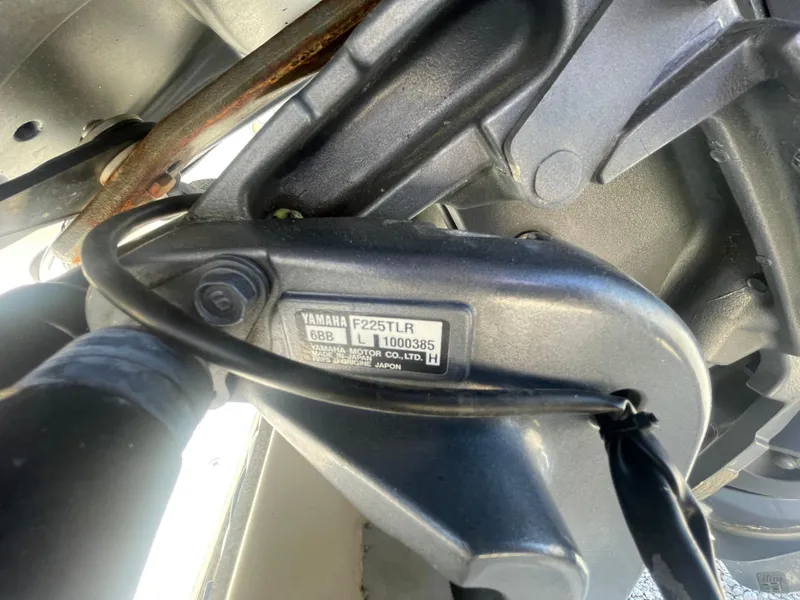 Slide: The Image of Close-up of Yamaha F225TLR engine part on 2000 KenCraft Challenger 215 boat. - 23