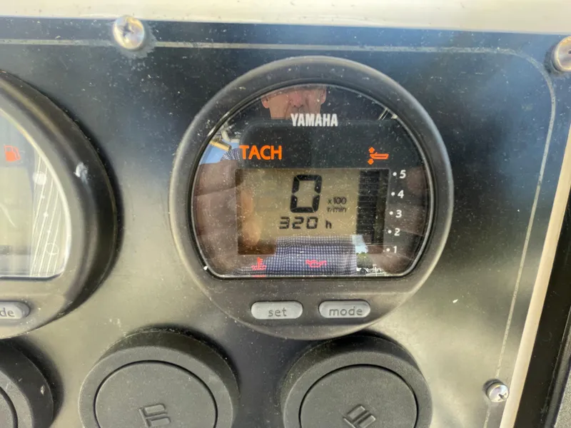 Slide: The Image of Yamaha tachometer on KenCraft Challenger 215, showing 320 hours, year 2000 model. - 24