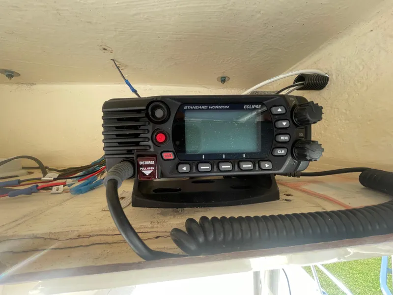 Slide: The Image of VHF marine radio on 2000 KenCraft Challenger 215 boat dashboard. - 25