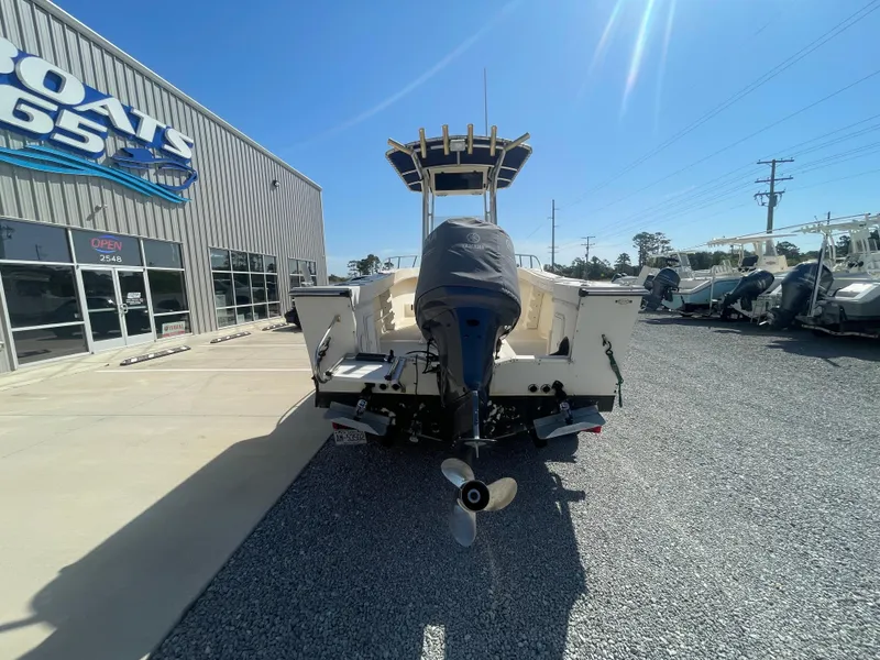 Slide: The Image of 2000 KenCraft Challenger 215 boat with Yamaha outboard motor at dealership. - 6