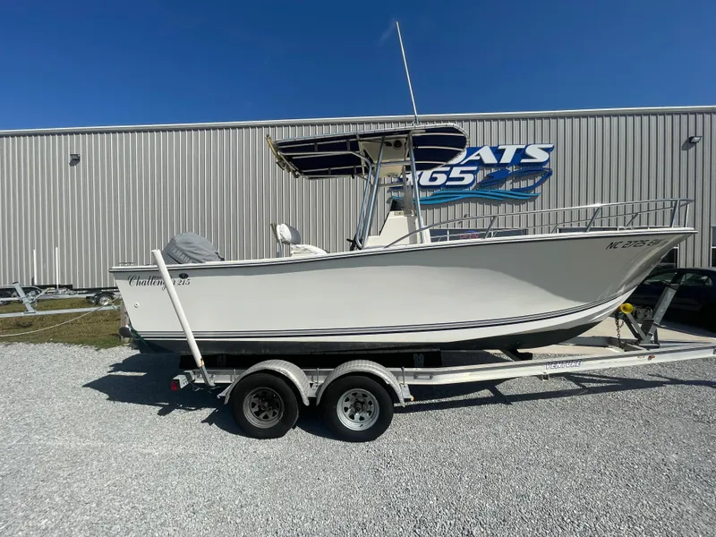 Slide: The Image of 2000 KenCraft Challenger 215 boat on trailer, parked outside a building. - 8
