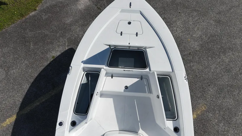 Slide: The Image of Overhead view of 2025 BlackJack 224 boat deck, featuring storage compartments. - 14