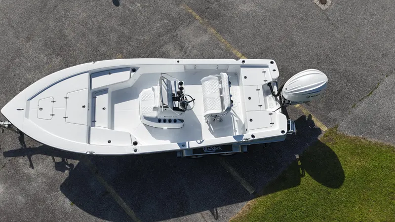Slide: The Image of Aerial view of 2025 BlackJack 224 boat on pavement, showcasing sleek design and modern features. - 18