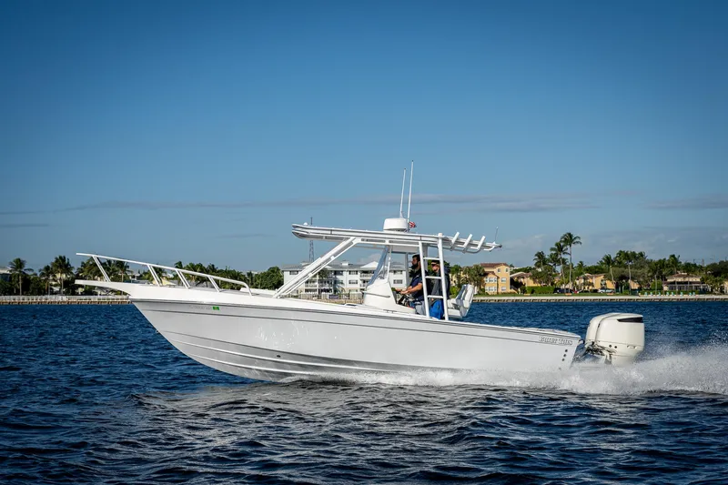 Slide: The Image of A 2004 Salt Shaker 300 CC boat cruising on a sunny day. - 1