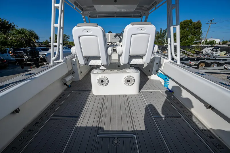 Slide: The Image of 2004 Salt Shaker 300 CC boat interior with dual seats and spacious deck. - 15
