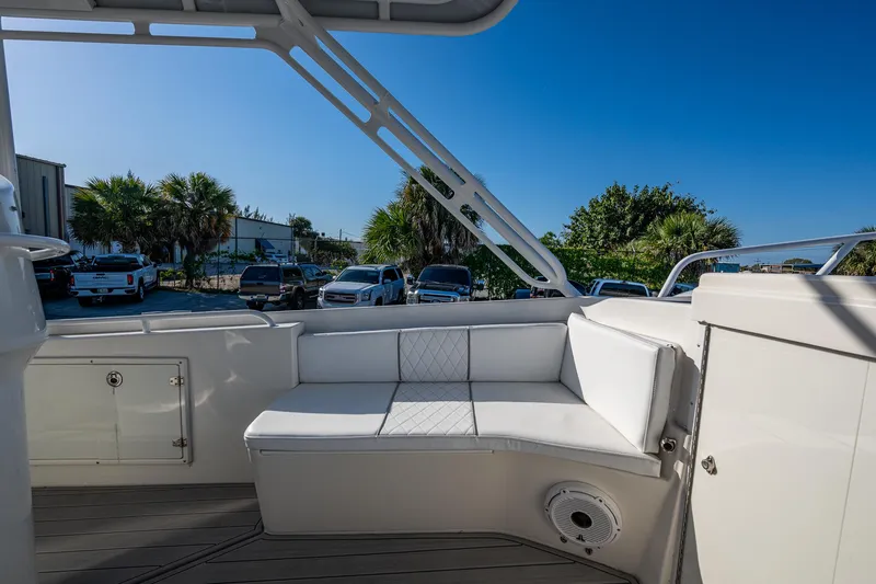 Slide: The Image of 2004 Salt Shaker 300 CC boat interior with white seating and outdoor view. - 16