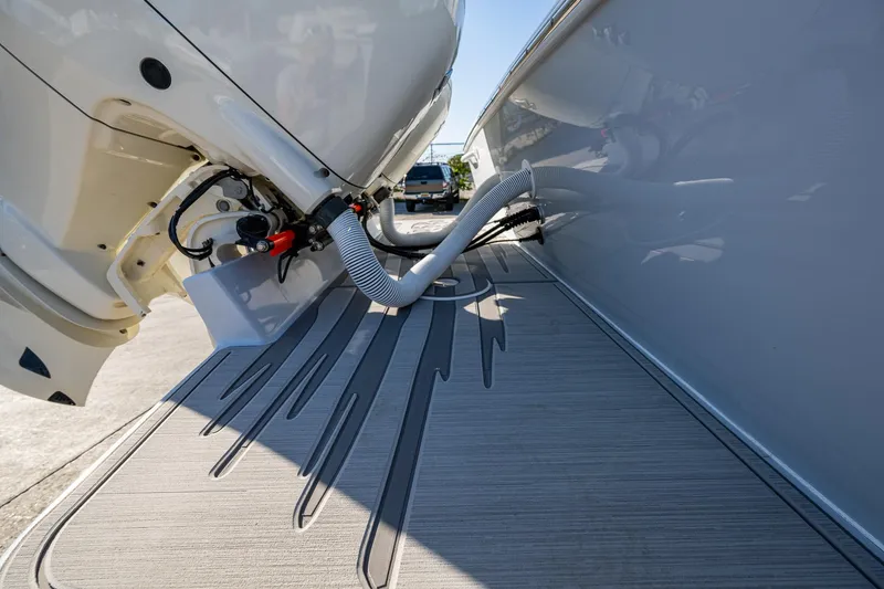 Slide: The Image of Close-up of a 2004 Salt Shaker 300 CC boat engine and deck details. - 19