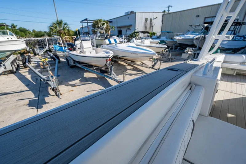 Slide: The Image of Outdoor boat storage area with various boats, including a 2004 Salt Shaker 300 CC. - 20