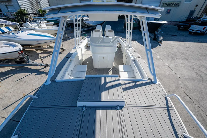 Slide: The Image of Open deck of a 2004 Salt Shaker 300 CC boat, docked at a marina. - 4