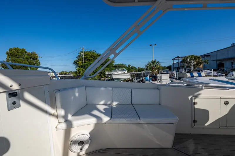 Slide: The Image of 2004 Salt Shaker 300 CC boat interior with white seating and outdoor view. - 7