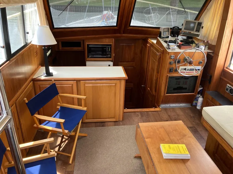 Slide: The Image of Interior of 1985 Wellcraft California boat with wooden furnishings and nautical equipment. - 8