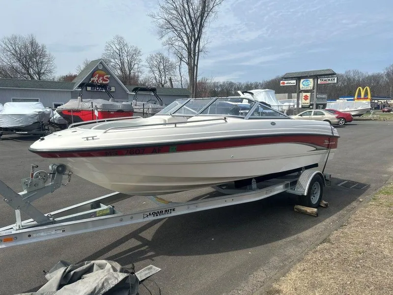 Slide: The Image of 2001 Chaparral 200 SSe boat on trailer in parking lot, overcast sky. - 3