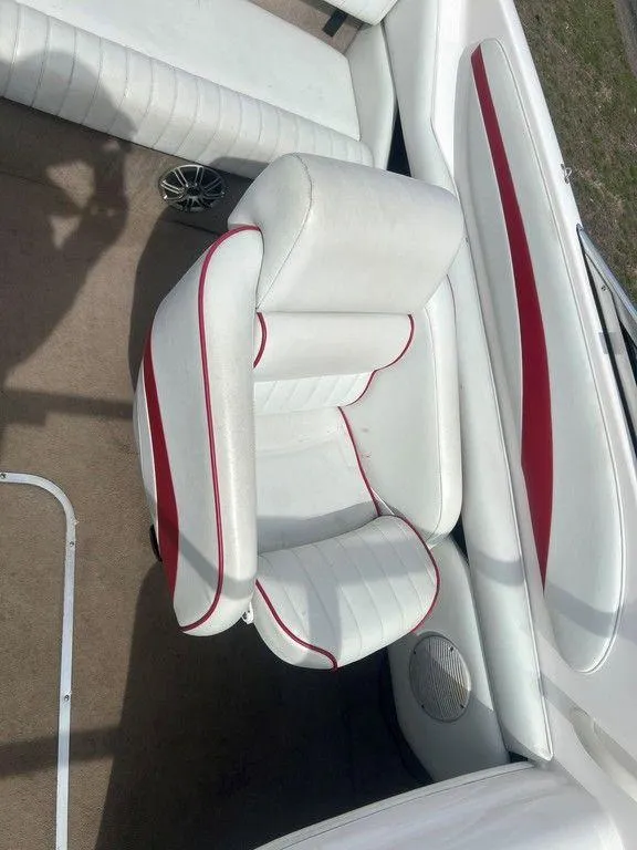 Slide: The Image of 2001 Chaparral 200 SSe boat interior with white and red seating. - 6