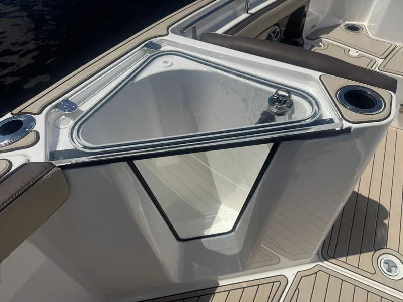 Slide: The Image of 2023 Yamaha Boats 255 FSH Sport E, featuring a sleek deck design with cup holders. - 21