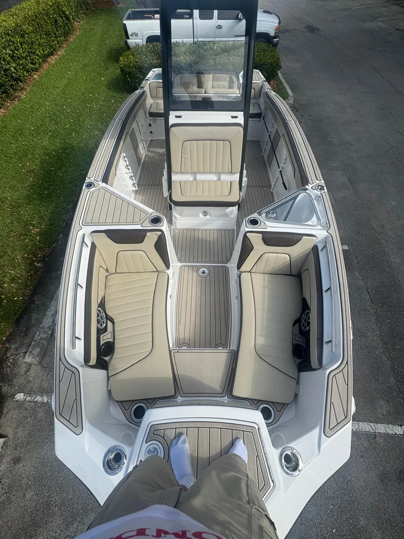 Slide: The Image of 2023 Yamaha Boats 255 FSH Sport E, top view, showcasing spacious seating and sleek design. - 26