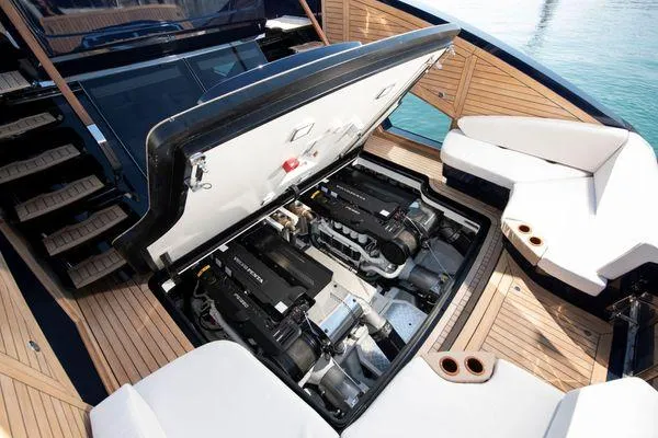 Slide: The Image of 2023 Lazzara LSX yacht engine compartment with open hatch, showcasing powerful engines and sleek design. - 12