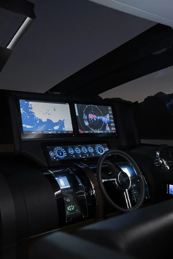Slide: The Image of 2023 Lazzara LSX yacht cockpit with advanced navigation displays and controls. - 15