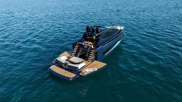 Slide: The Image of 2023 Lazzara LSX yacht on open water, featuring sleek design and spacious deck. - 5