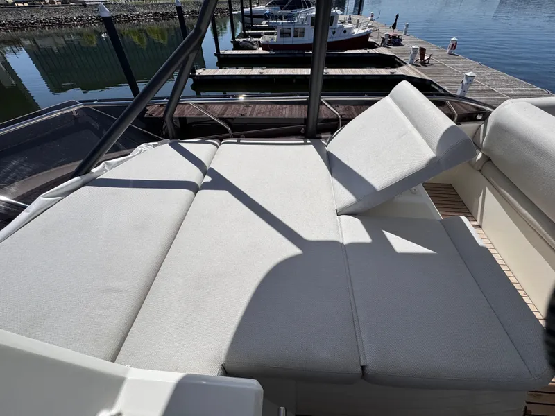Slide: The Image of Luxurious seating on 2023 Prestige 520 F-Line yacht at marina. - 13