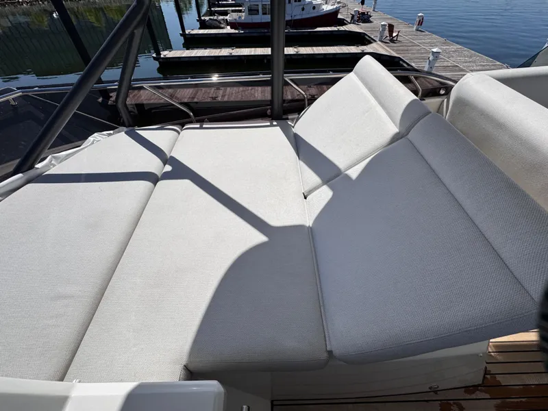 Slide: The Image of Prestige 520 F-Line 2023 yacht with spacious sunbathing area on deck. - 14