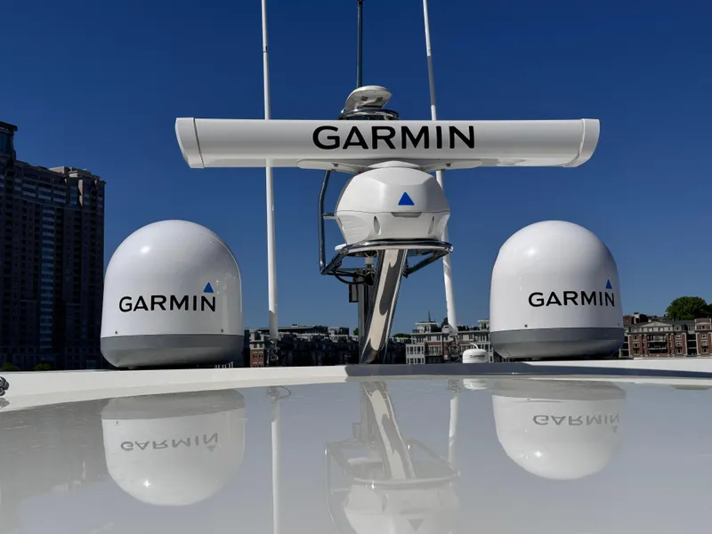 Slide: The Image of Garmin radar equipment on 2023 Prestige 520 F-Line yacht under clear blue sky. - 16