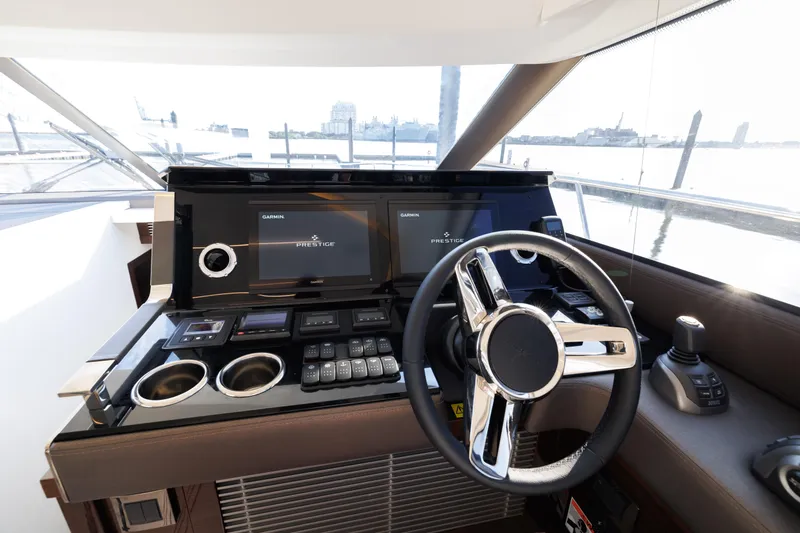 Slide: The Image of 2023 Prestige 520 F-Line yacht helm with modern controls and dual displays. - 17