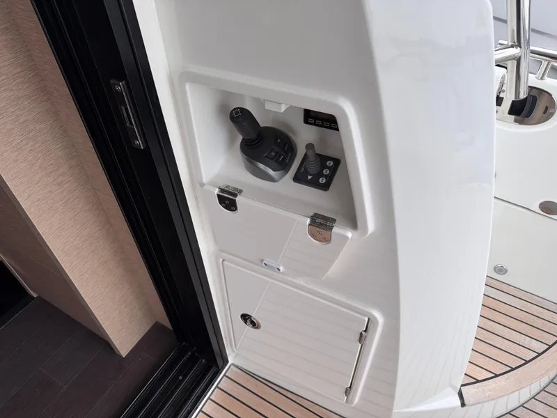 Slide: The Image of Control panel on 2023 Prestige 520 F-Line yacht, featuring joystick and switches. - 19
