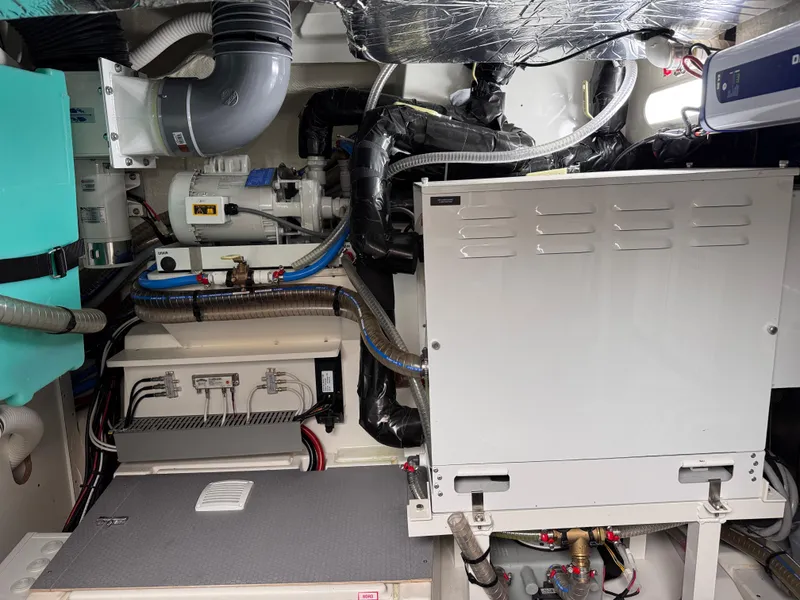 Slide: The Image of Engine room of 2023 Prestige 520 F-Line yacht with mechanical equipment and wiring. - 26