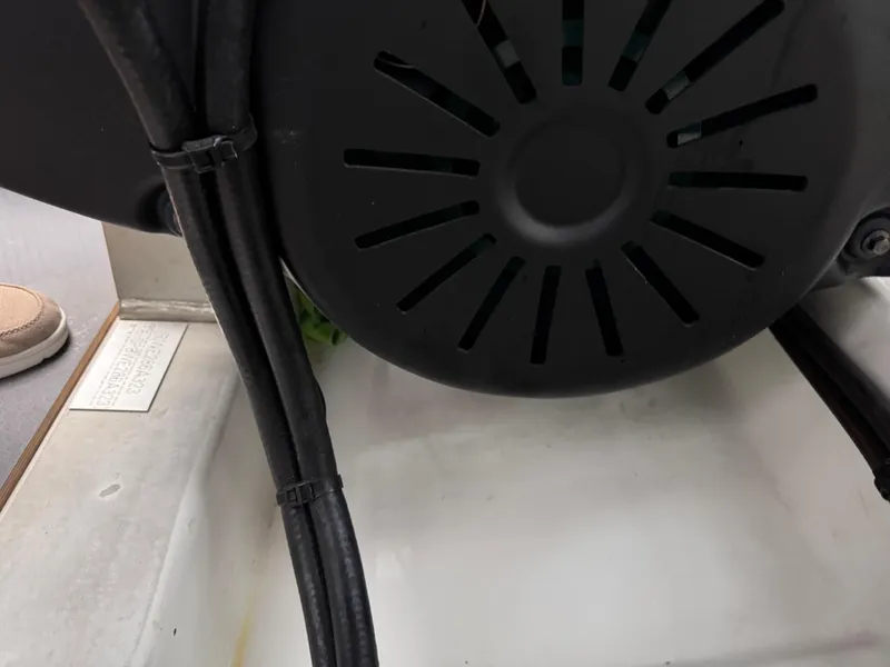 Slide: The Image of Engine compartment of a 2023 Prestige 520 F-Line yacht, featuring cables and ventilation. - 29