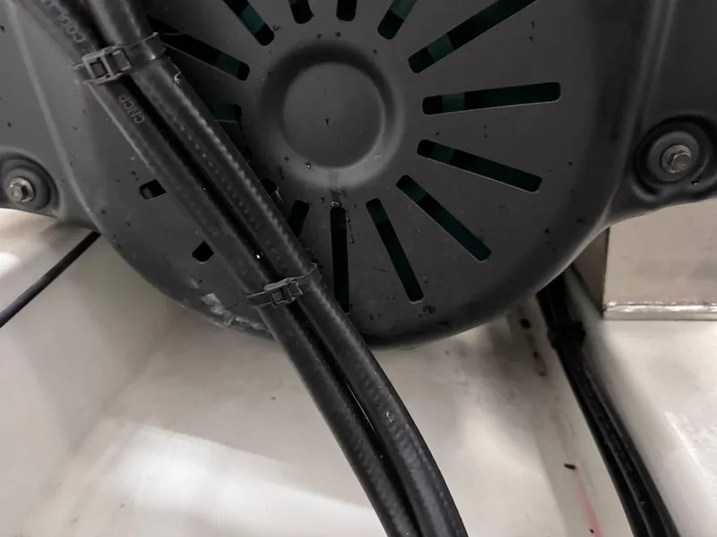 Slide: The Image of Close-up of 2023 Prestige 520 F-Line engine component with cables and ventilation slots. - 31