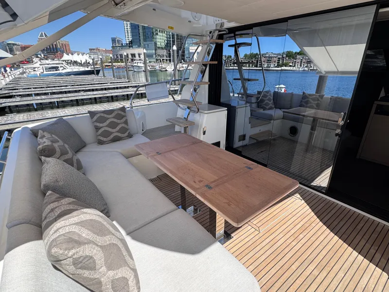 Slide: The Image of Luxurious 2023 Prestige 520 F-Line yacht with elegant seating and waterfront view. - 47