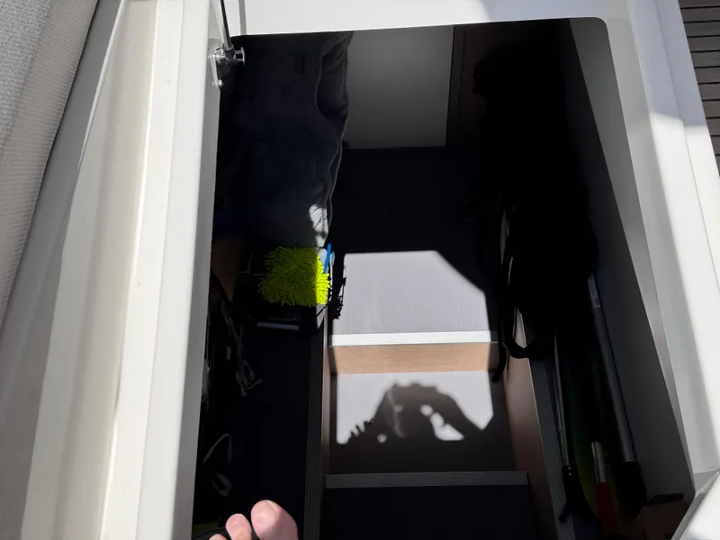 Slide: The Image of Storage compartment on a 2023 Prestige 520 F-Line yacht, partially open with visible interior. - 50