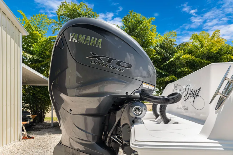 Slide: The Image of 2024 Contender 35 ST with Yamaha XTO Offshore engine, parked outdoors. - 12