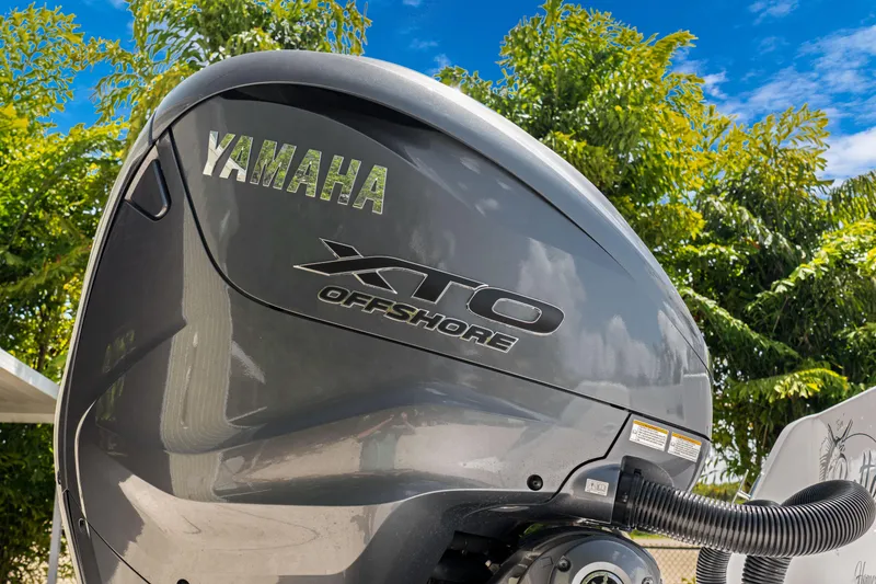 Slide: The Image of Yamaha XTO Offshore engine on 2024 Contender 35 ST boat, with trees in the background. - 13