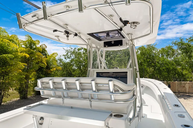 Slide: The Image of 2024 Contender 35 ST boat with sleek design, featuring a modern helm and seating area. - 16