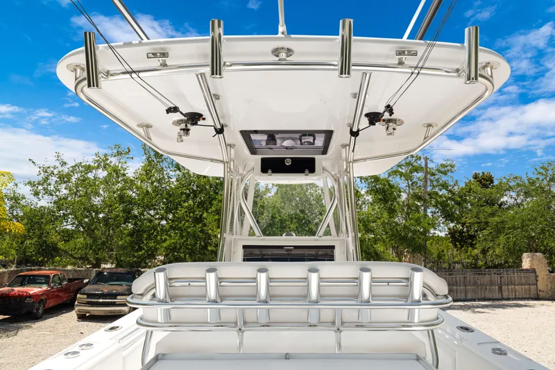 Slide: The Image of 2024 Contender 35 ST boat with sleek design and advanced features, docked outdoors. - 17