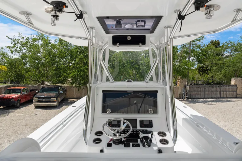 Slide: The Image of 2024 Contender 35 ST boat console with steering wheel and navigation system. - 20