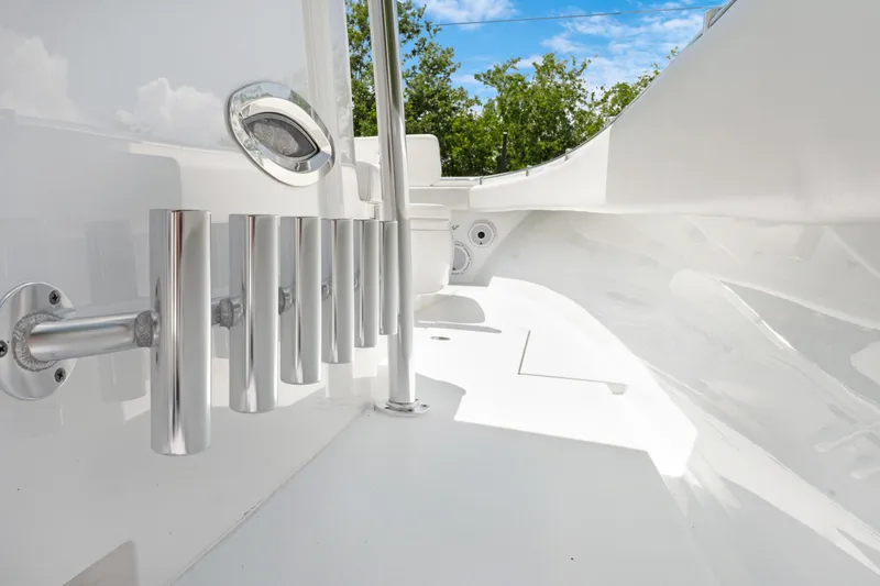 Slide: The Image of 2024 Contender 35 ST boat interior with rod holders and sleek white design. - 21