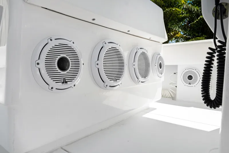 Slide: The Image of 2024 Contender 35 ST boat speakers, white interior, outdoor setting. - 23