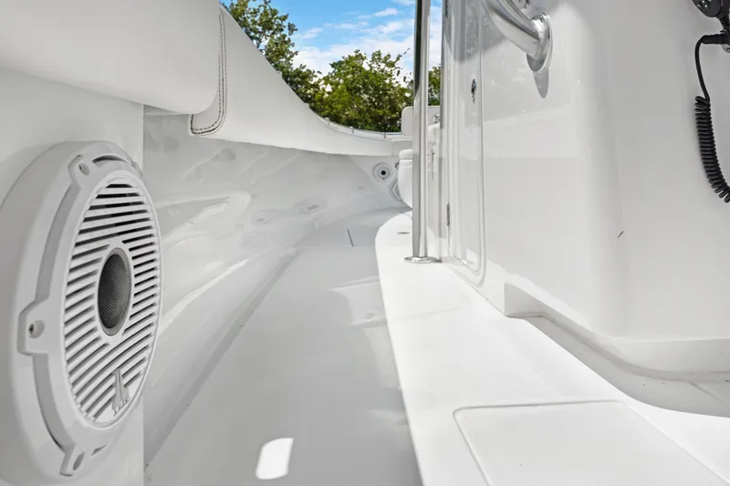 Slide: The Image of 2024 Contender 35 ST boat interior with speaker, sleek white design, and stainless steel accents. - 26