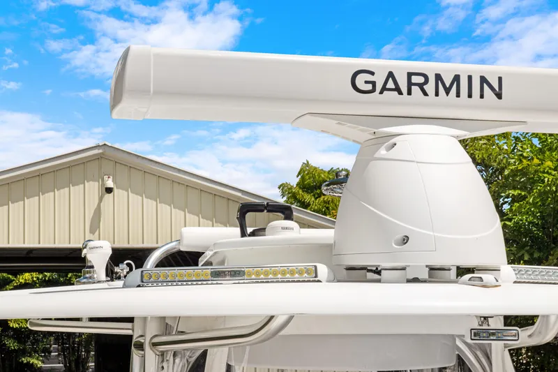 Slide: The Image of 2024 Contender 35 ST boat with Garmin radar, clear sky background. - 38