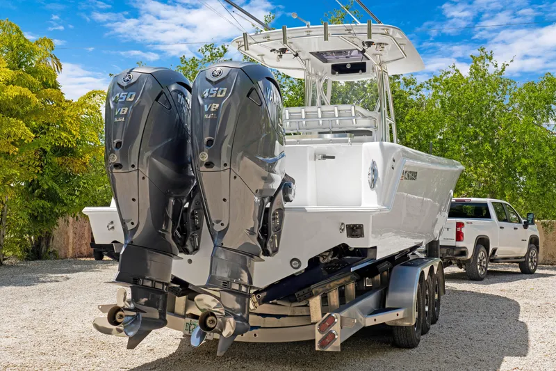 Slide: The Image of 2024 Contender 35 ST boat with dual Yamaha 450 V8 engines on a trailer. - 5
