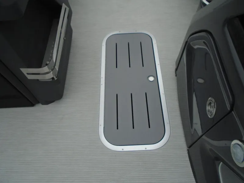 Slide: The Image of 2025 Bennington M Swingback 24 MSB boat deck with storage compartment. - 10