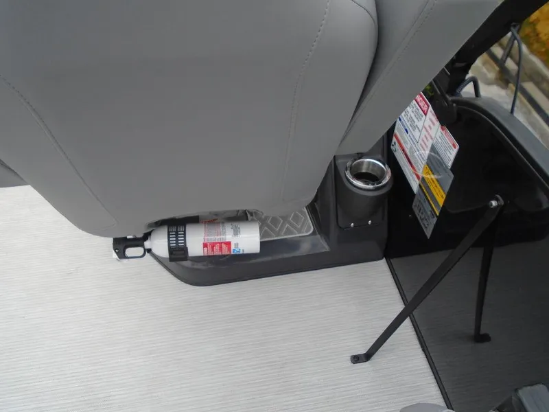 Slide: The Image of 2025 Bennington M Swingback 24 MSB interior with fire extinguisher and cup holder. - 15